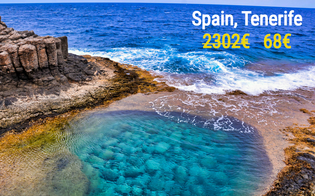 A high angle shot of a beautiful sea surrounded by rock formations in the Canary Islands, Spain